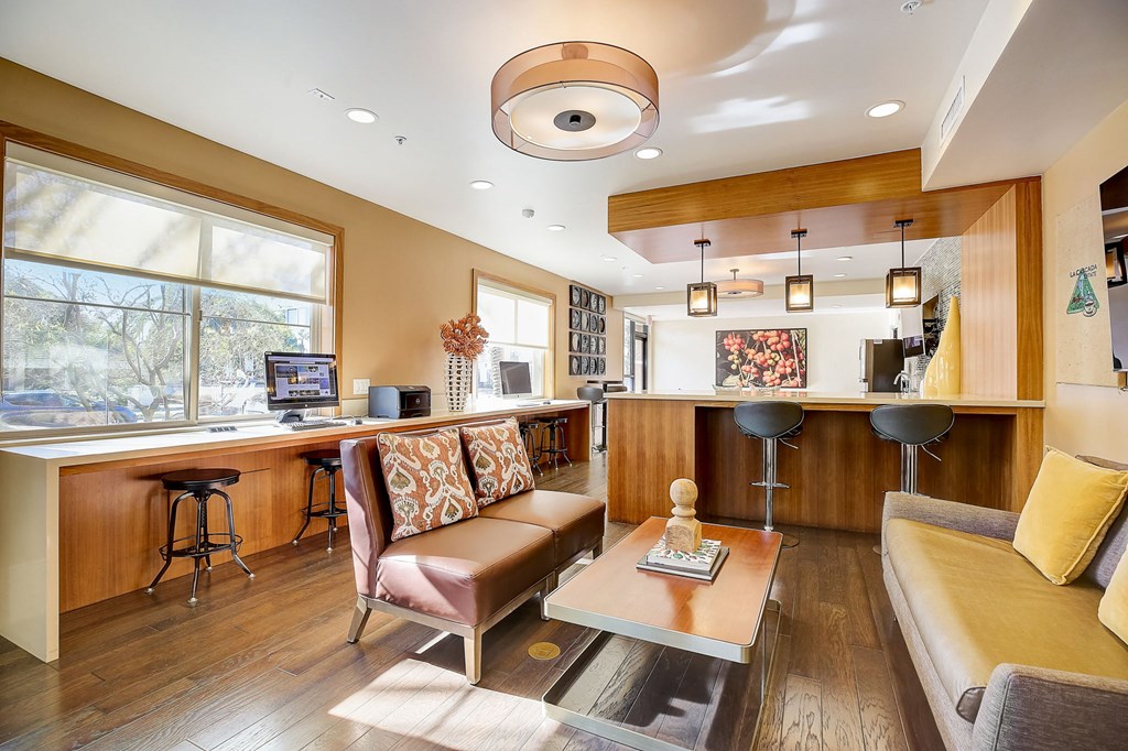 a living room with a kitchen and a couch