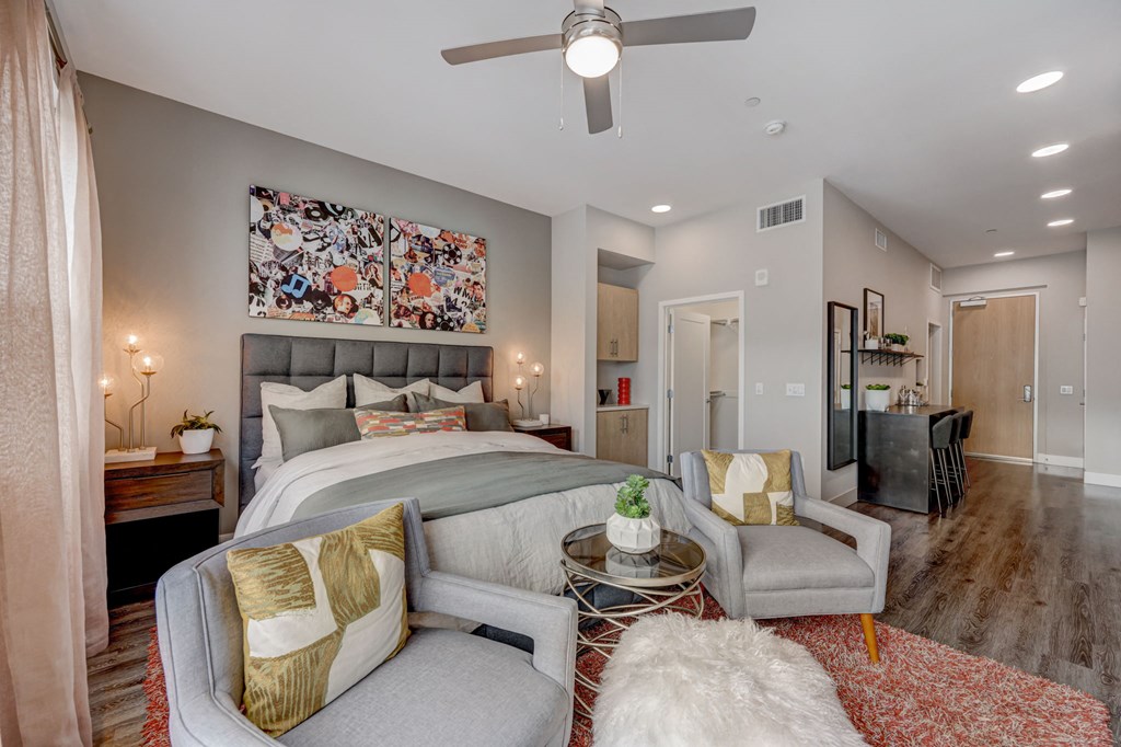 Bedroom with a large bed and a couch