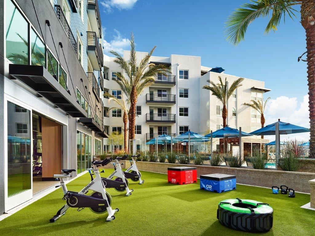 a group of exercise equipment in the middle of an apartment building