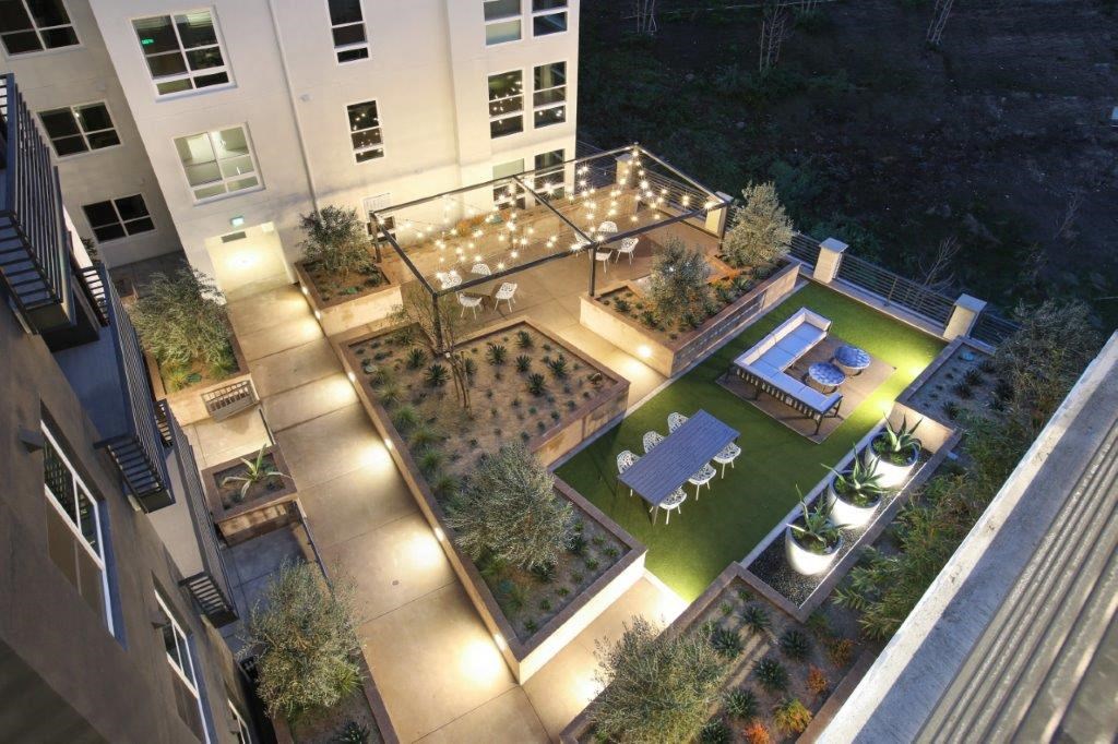 an aerial view of a yard with a table and chairs