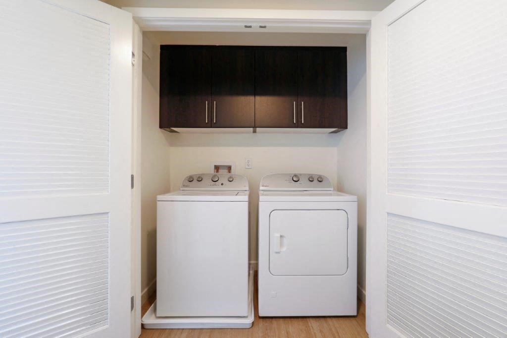 a laundry room with two washes and a dryer in it