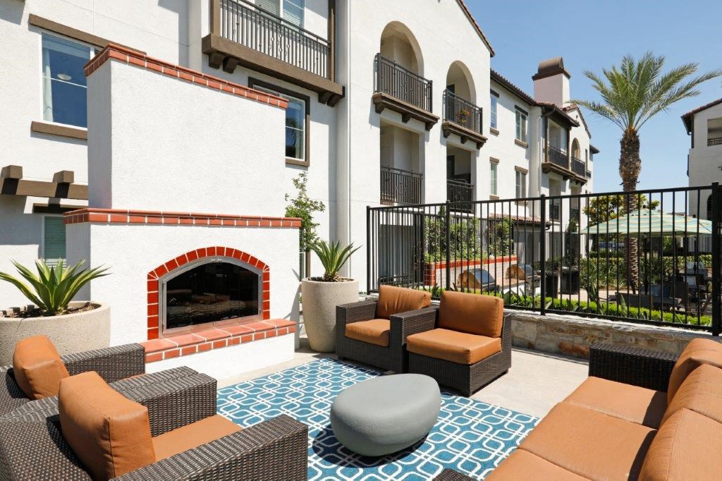 a living room with couches and a fireplace