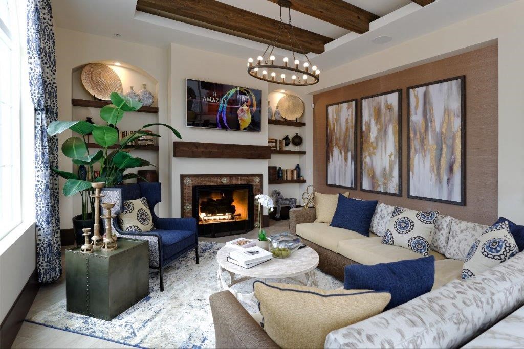 a living room with a white couch and a fireplace