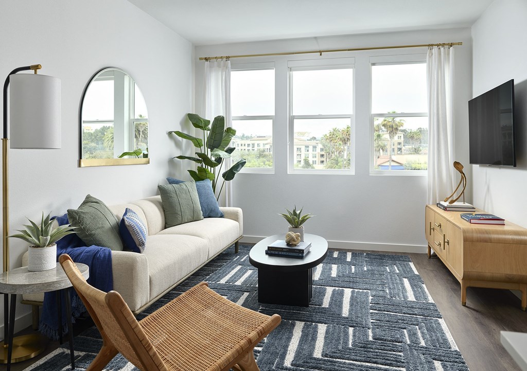 a living room with a couch and a table and a tv
