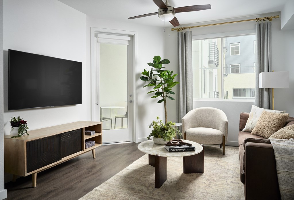 a living room with a couch and a tv