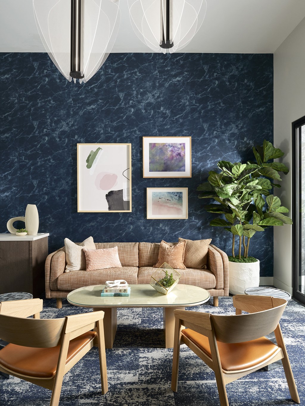 a living room with a blue wall and a couch and a table