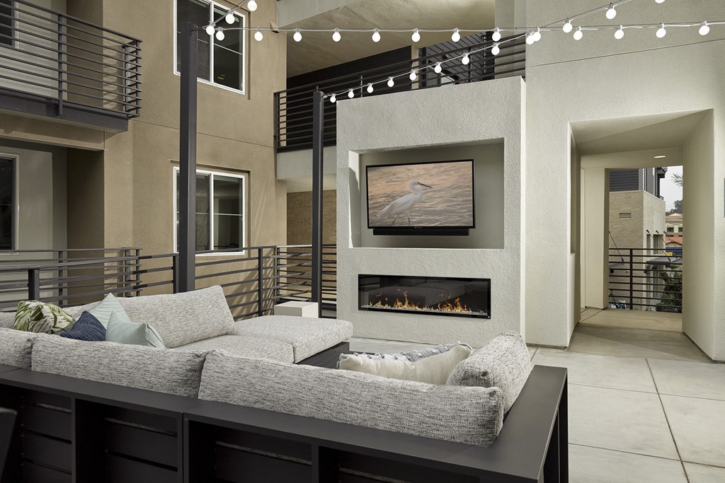 a living room with a couch and a fireplace