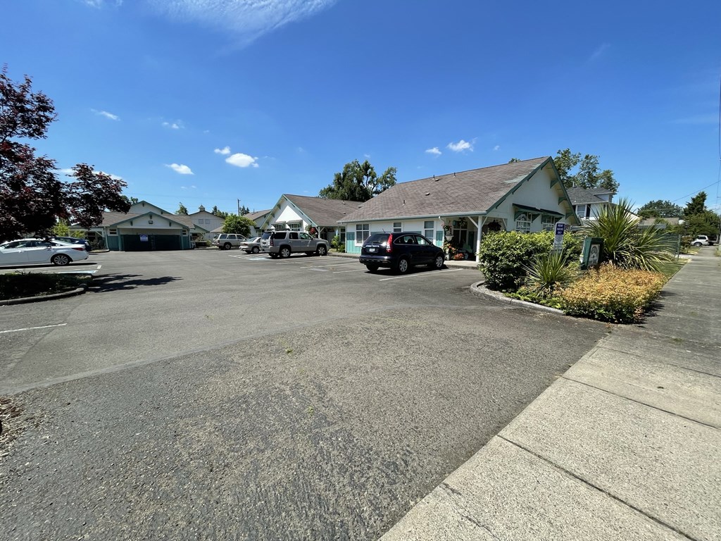 a parking lot in front of a house