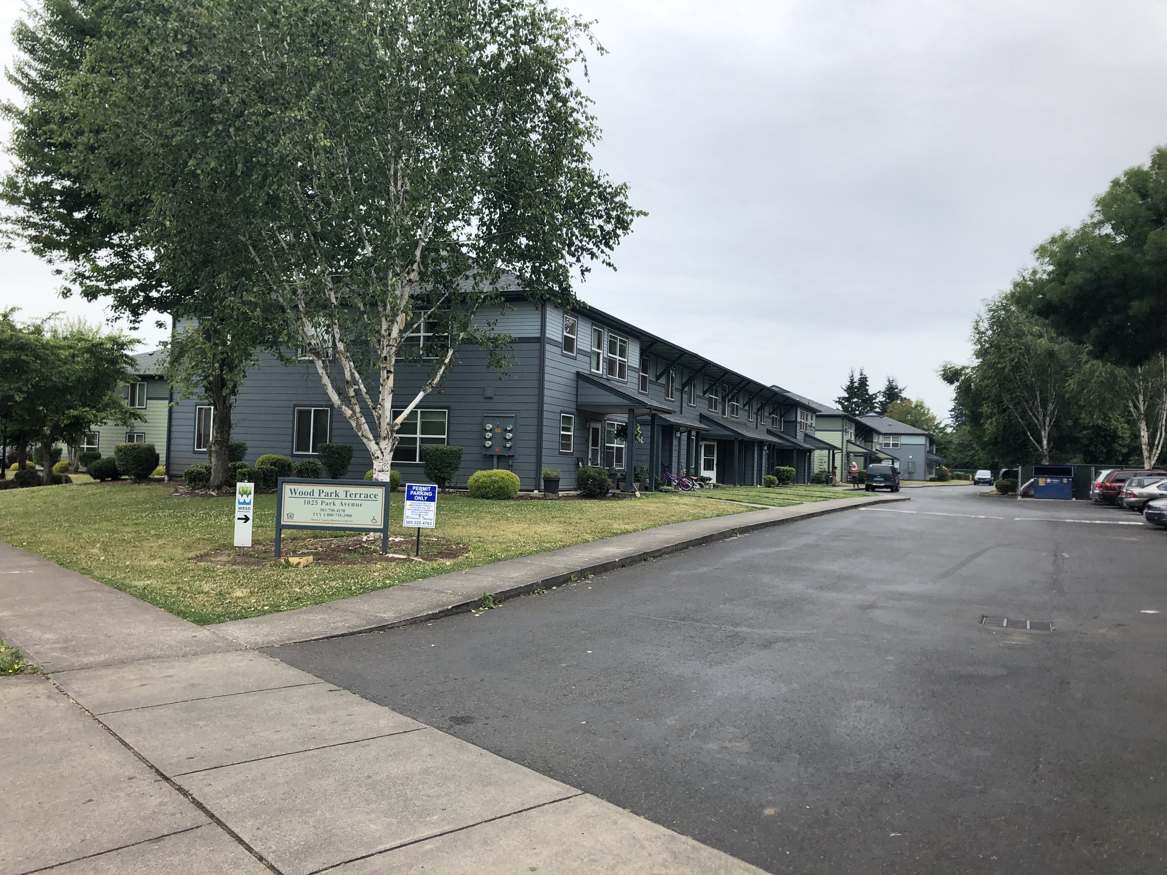 Building exterior view with site signage