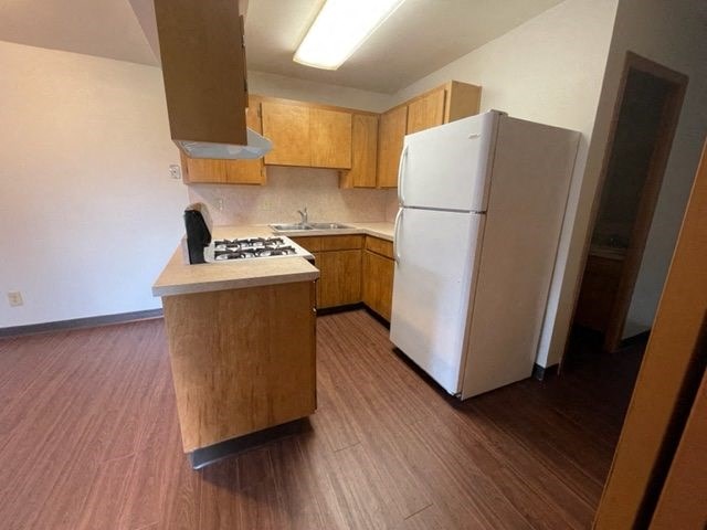 Kitchen view of refrigerator and sink