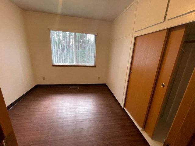 Bedroom view of window and closet