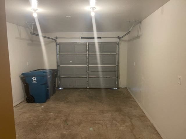 Single car garage, interior with finished walls