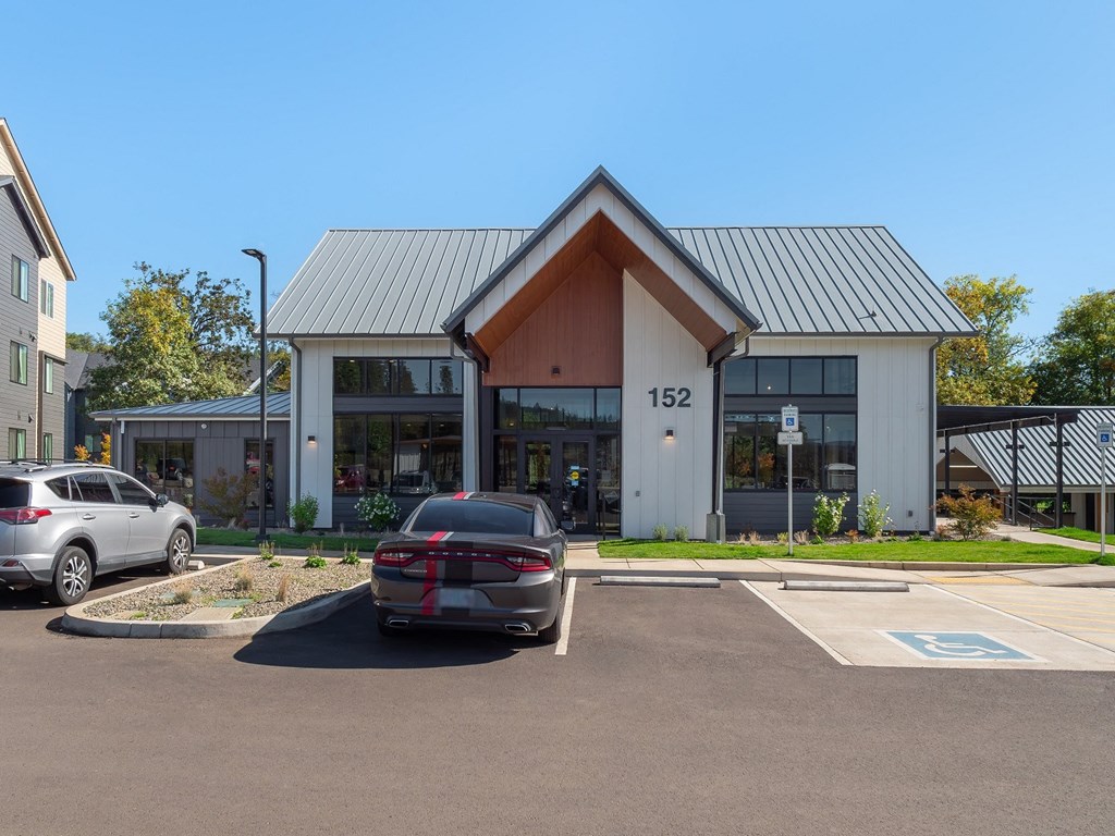 a car parked in a parking lot in front of a building