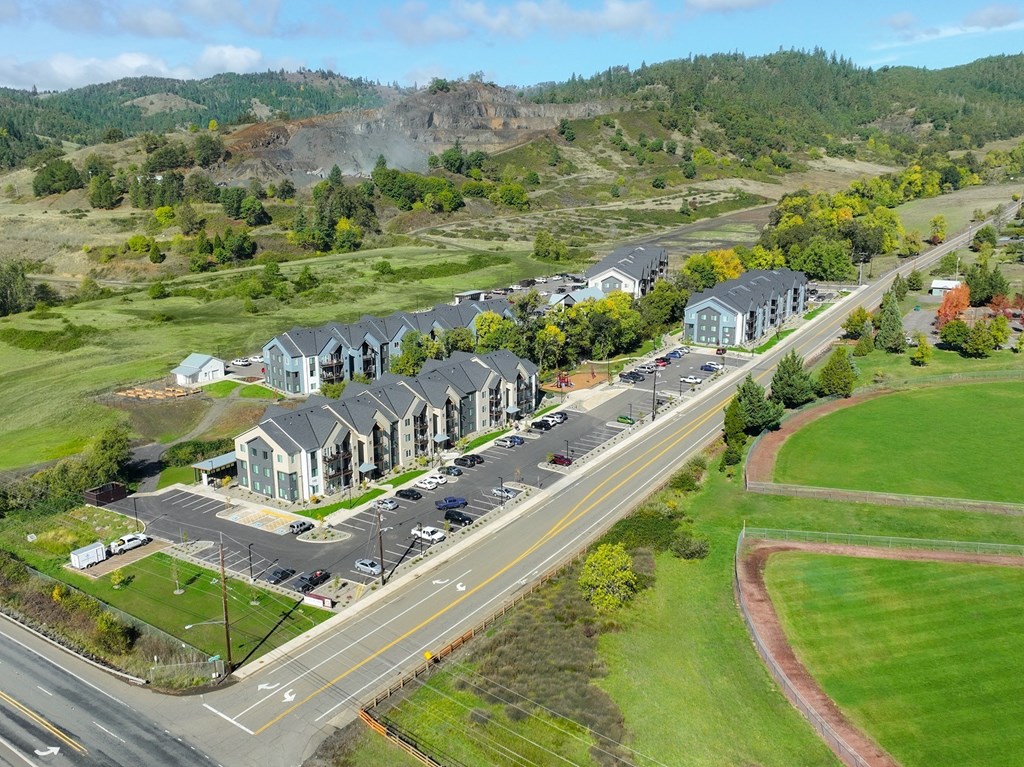 a group of houses sitting on the side of a road