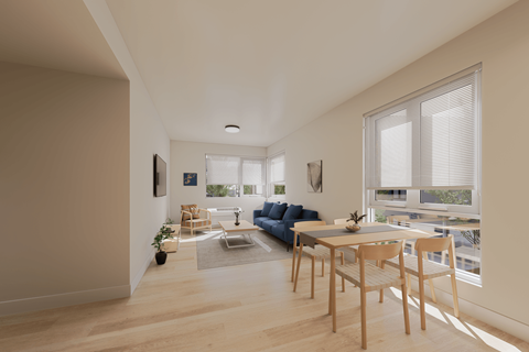 A modern living room with a blue couch and a dining table.
