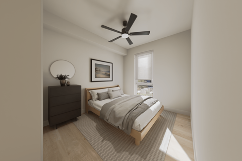 A bedroom with a bed, dresser, and a ceiling fan.