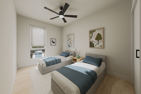 A bedroom with two beds and a ceiling fan.