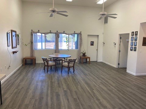 A room with a table and chairs in it.