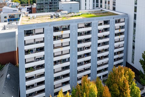 an aerial view of a building with a green roof