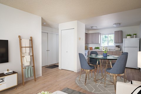 A modern kitchen with a dining table and chairs.