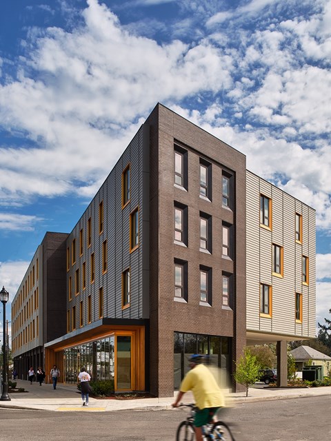 A modern building with a street in front of it.