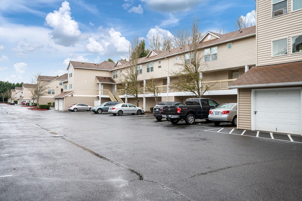 a parking lot at the whispering winds apartments in pearland, tx