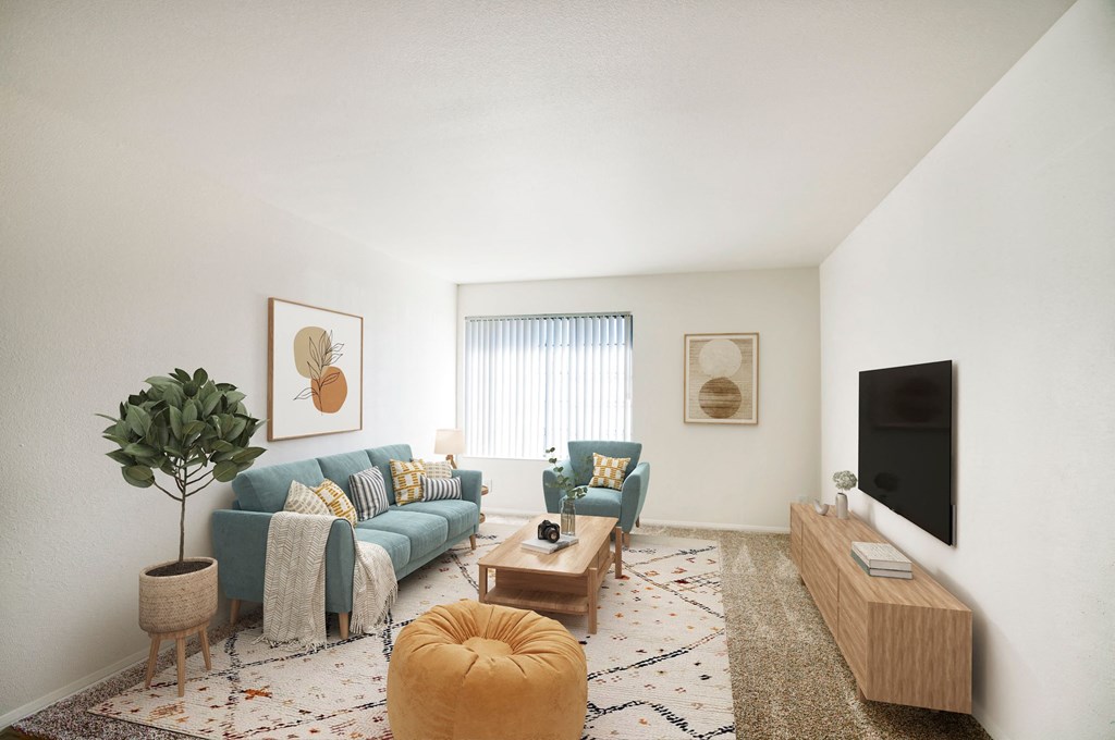 a living room with a blue couch and a tv