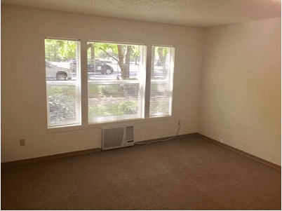 an empty room with a large window in it