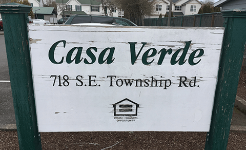 a sign in front of a street