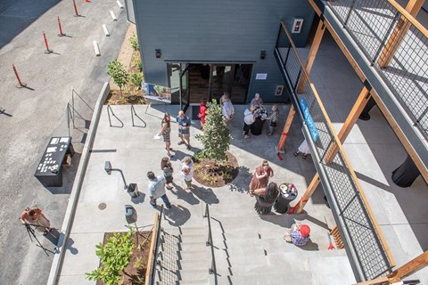 a group of people standing outside of a building