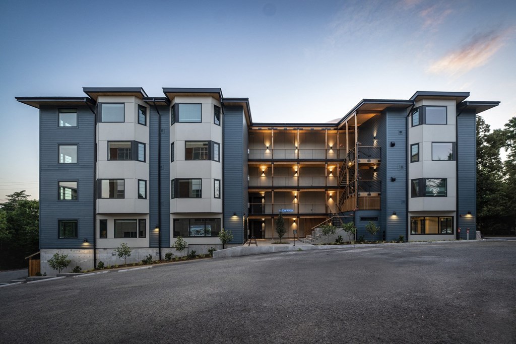 front view of an apartment building at dusk