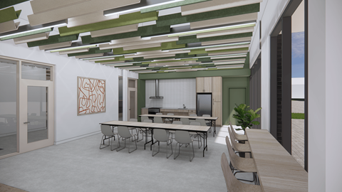A conference room with a long table and chairs.