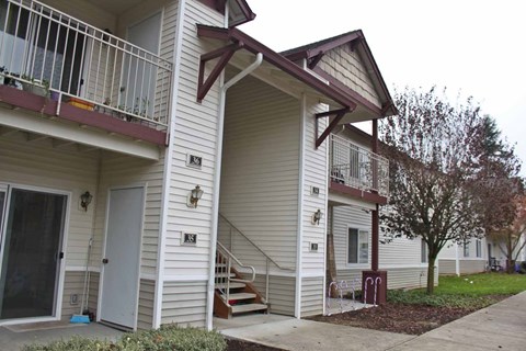 A house with a brown roof and a white door.