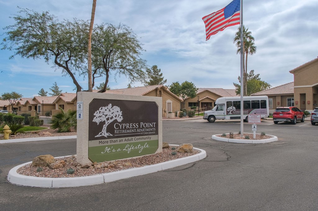 the sign at the entrance of church pointe apartments parking lot flag