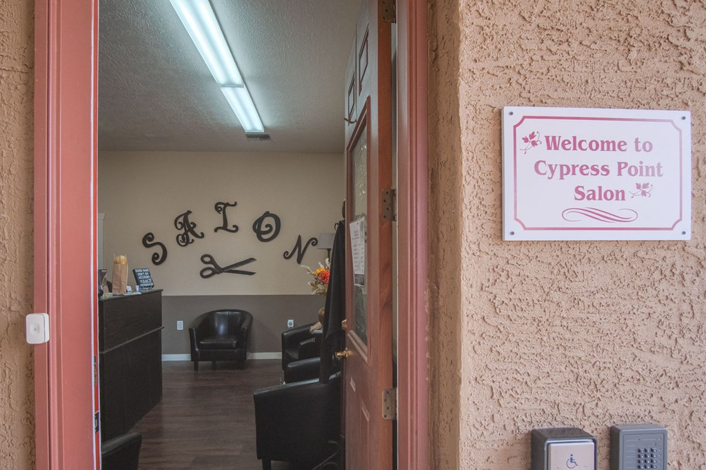a sign that says welcome to cypress point salon