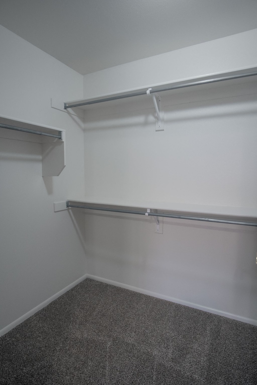 a room with two empty shelves in it