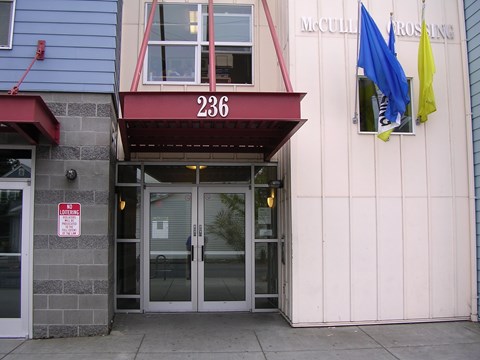 The building has a red awning with the number 236 on it.