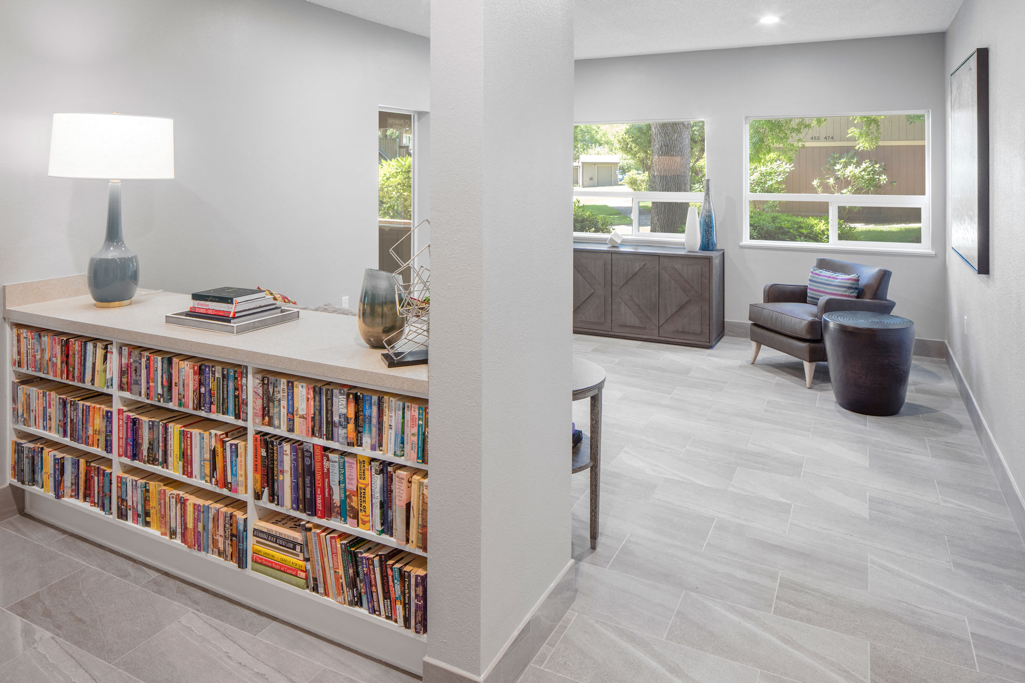 a living room with a bookshelf full of books