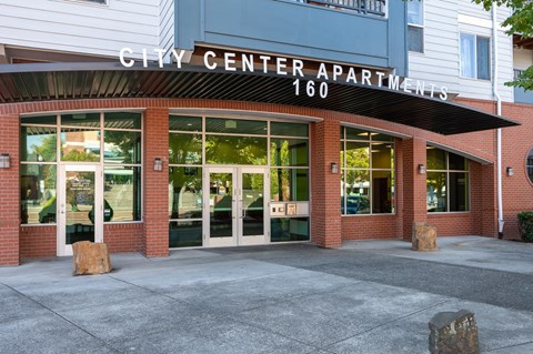 The front of the City Center Apartments building with the number 160 on it.