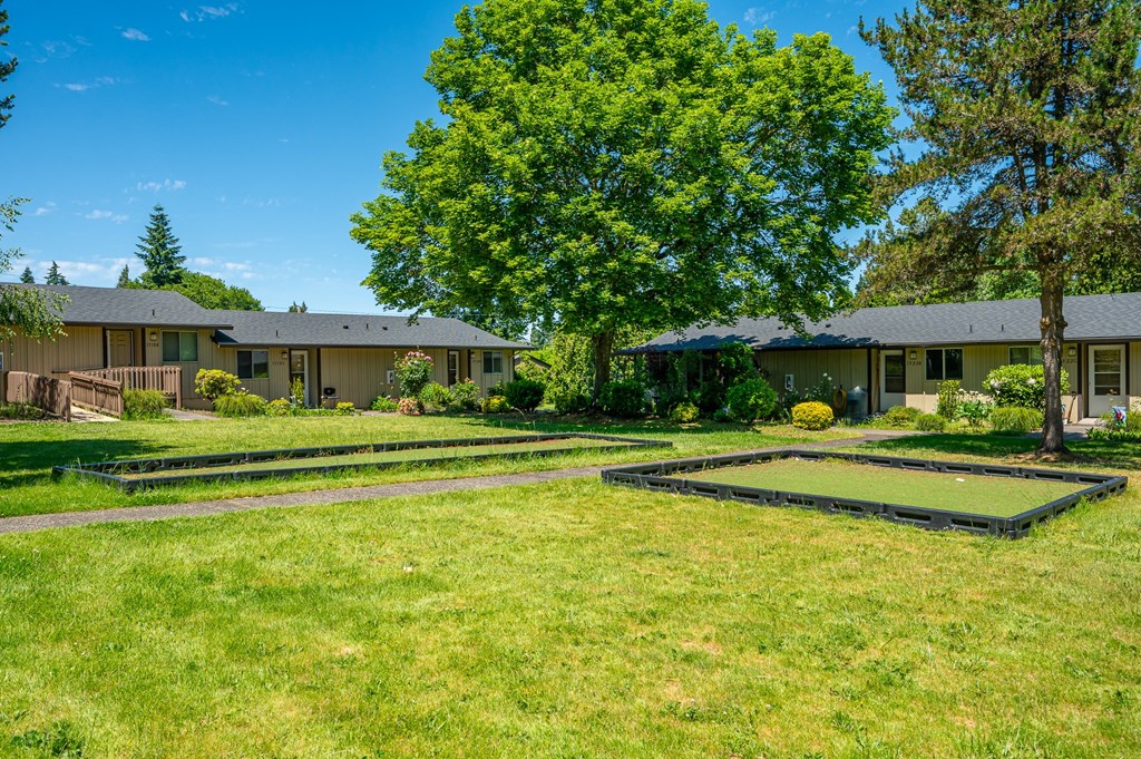 A sunny day at a residential area with houses and green lawns.