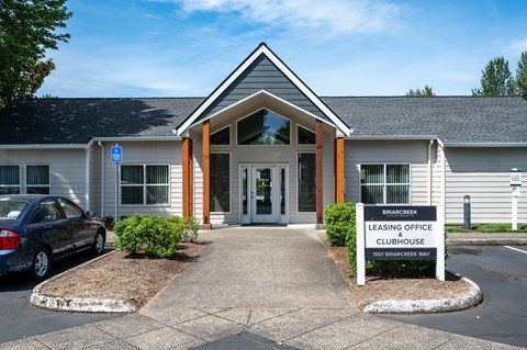 The front of a building with a sign that says