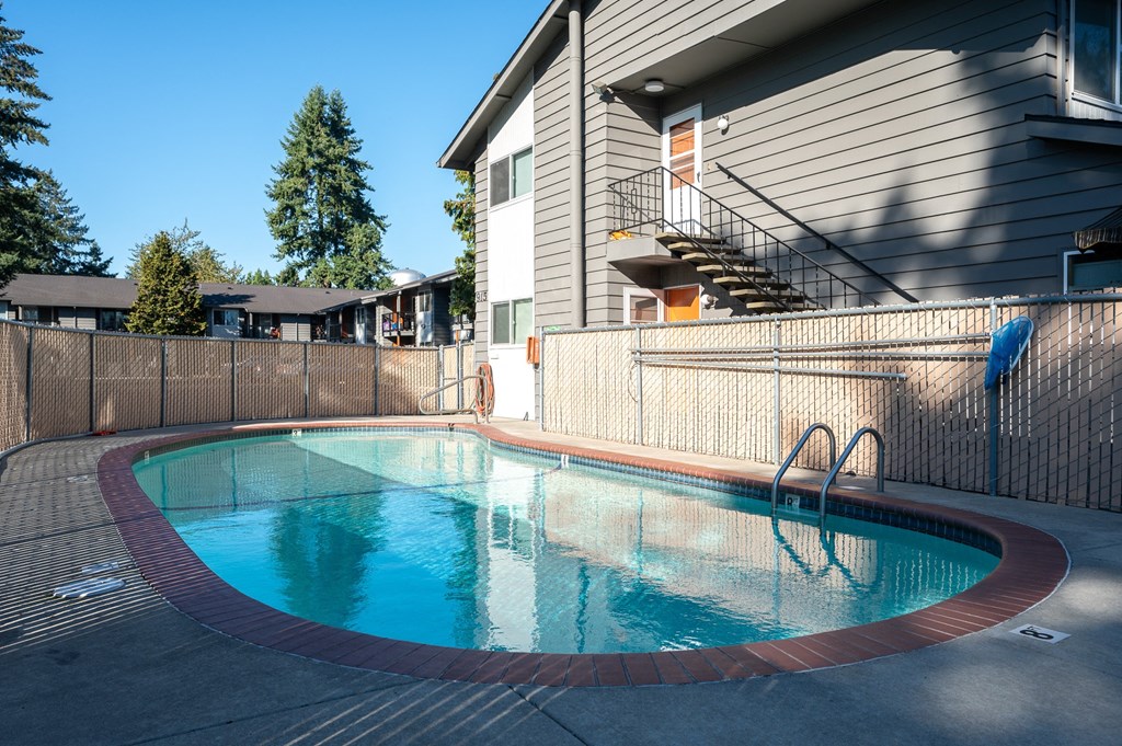 a swimming pool in front of a house