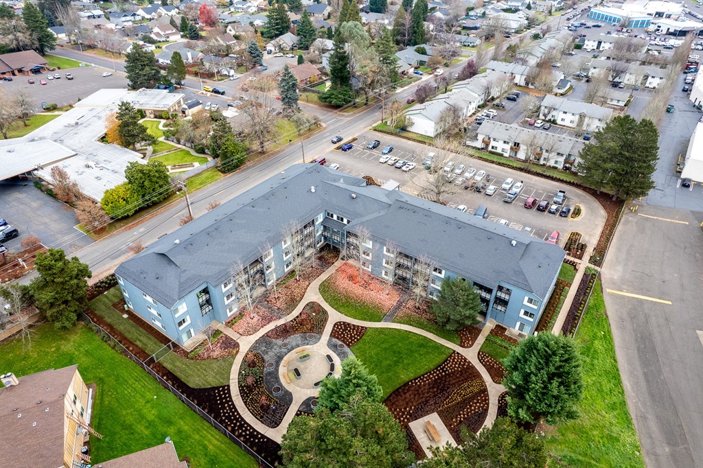 an aerial view of a building with a courtyard
