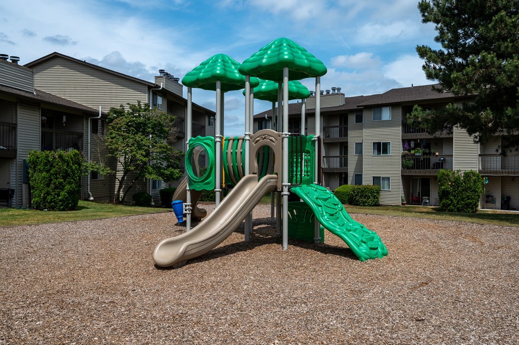 a playground at the whispering winds apartments in pearland, tx