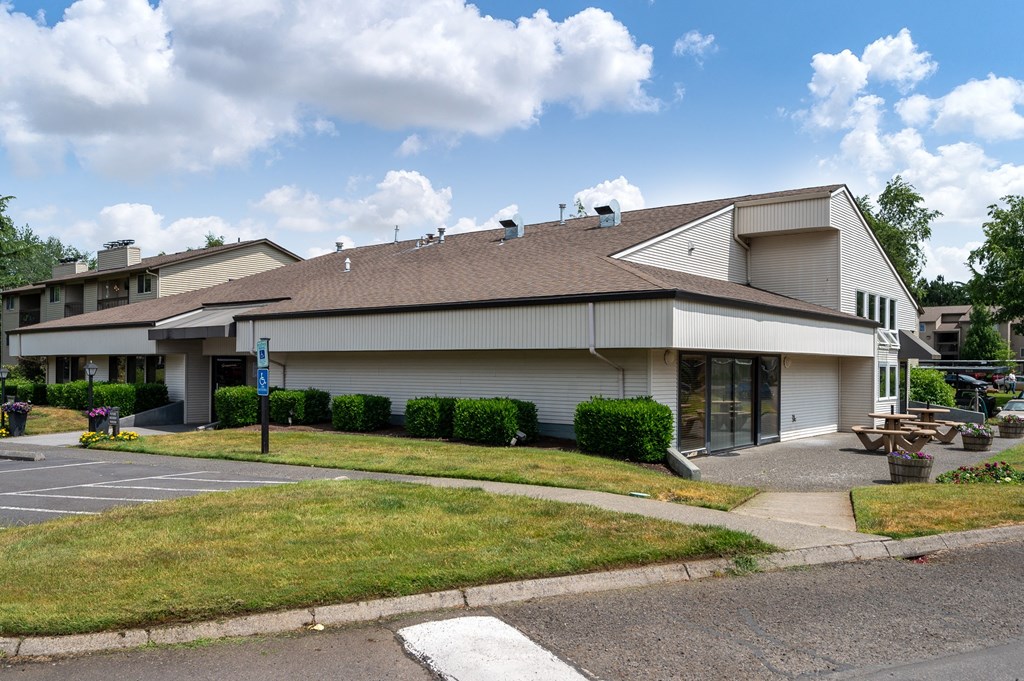 a large white building with a brown roof