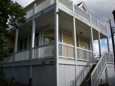 a view of the front porch of an old house
