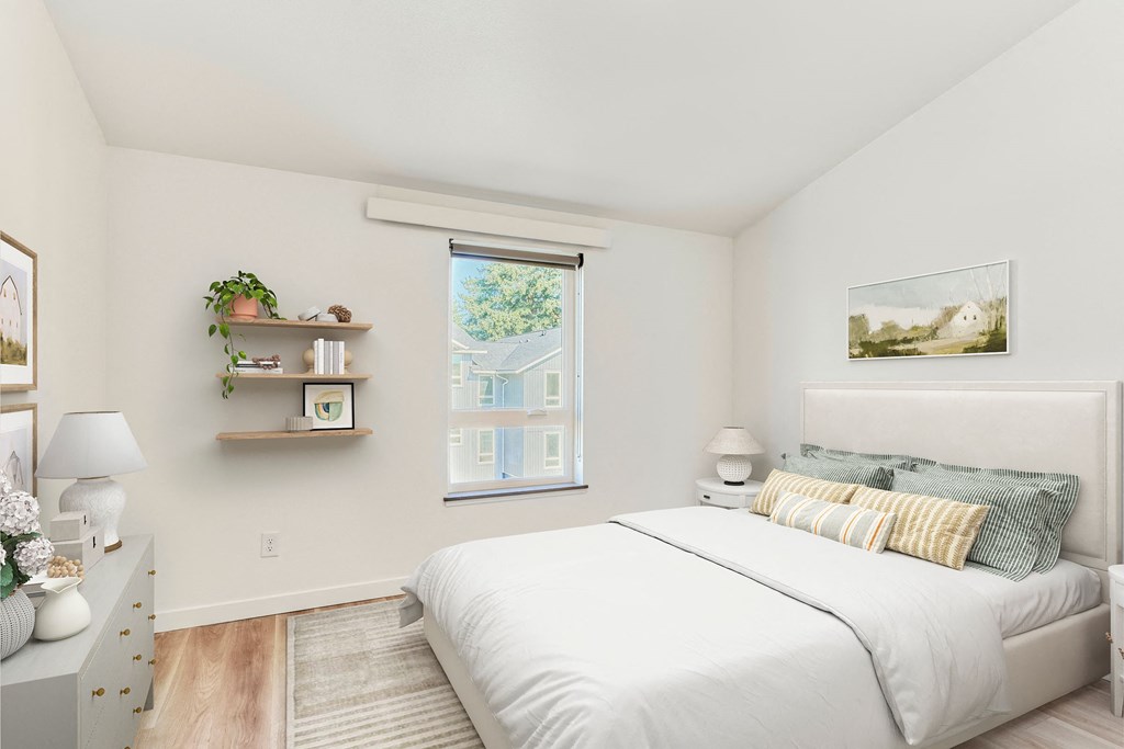 a bedroom with a large bed and a window