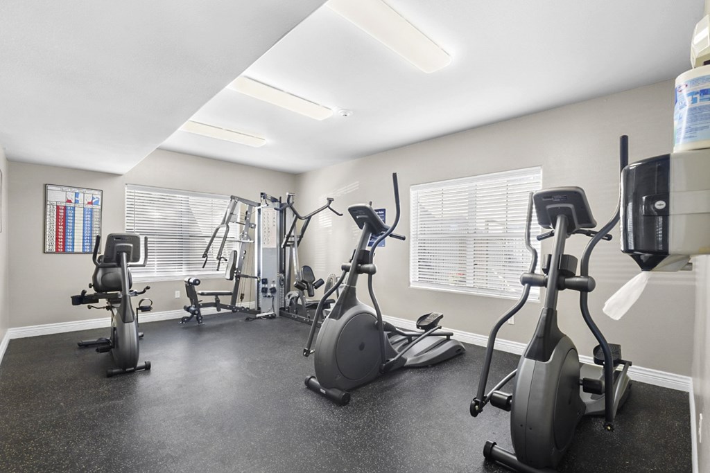 A spacious gym with a variety of exercise equipment.