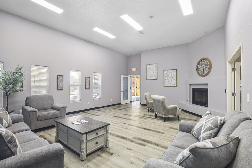 A living room with grey couches and a coffee table.