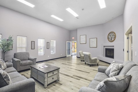 A living room with grey couches and a coffee table.